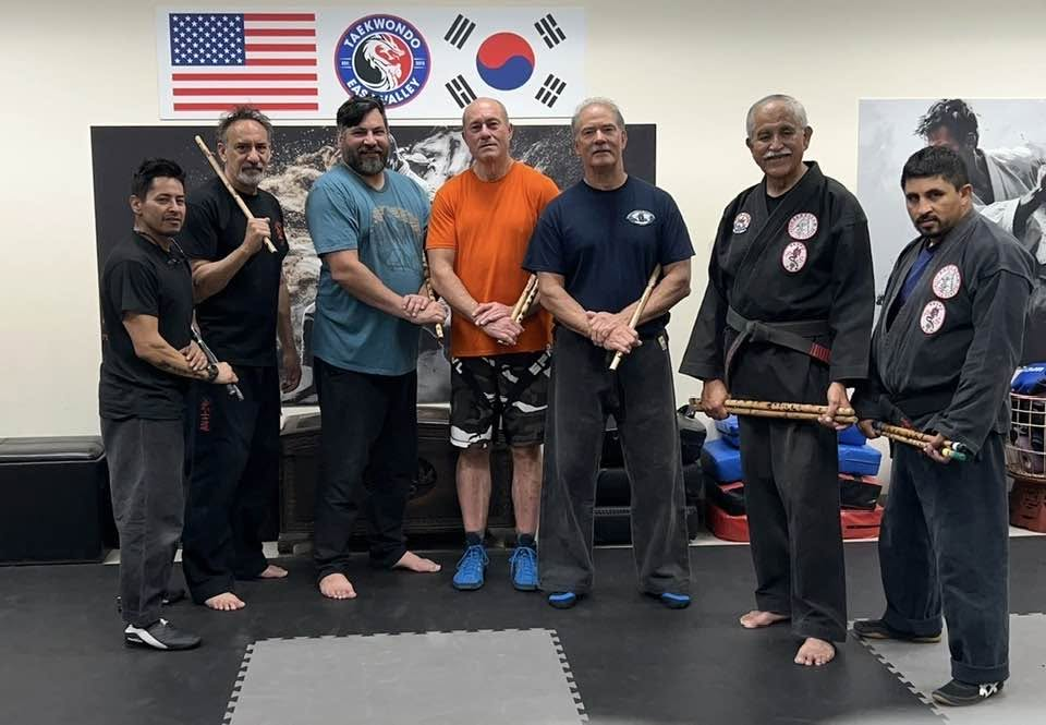 East Valley TEK Eskrima class holding training sticks